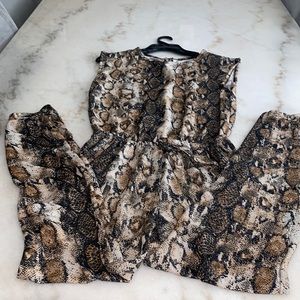 Animal print jumpsuit size M ,, back cut-out …good conditions